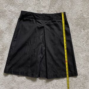 Kenar Black skirt with flirty pleat